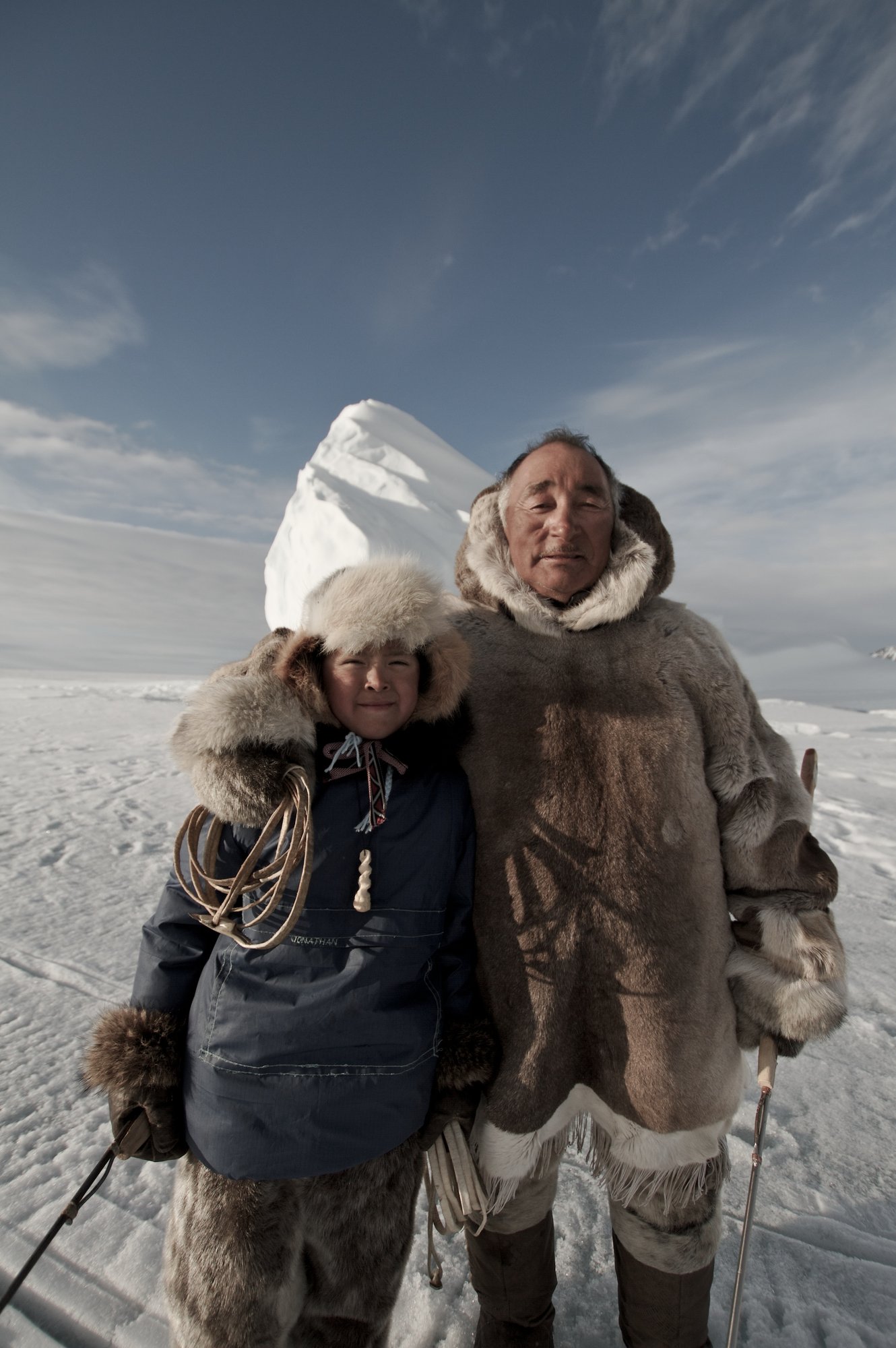 Arctic Kingdm Guides_ Inuit Father and Son in traditional gear